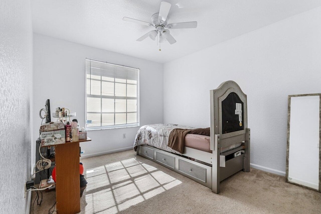 bedroom with light carpet and ceiling fan