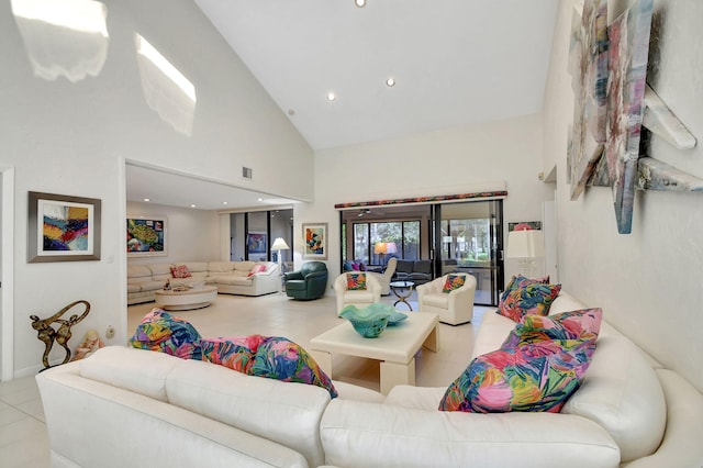 tiled living room with high vaulted ceiling