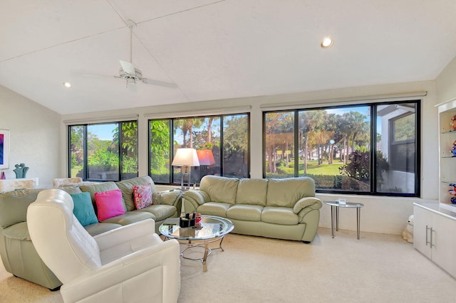 living room featuring ceiling fan and vaulted ceiling