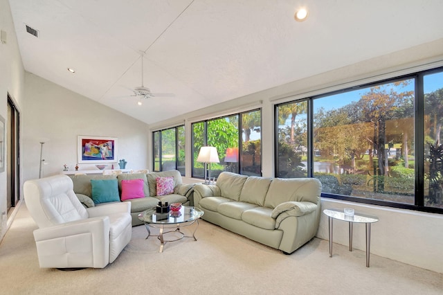 living room featuring light carpet, vaulted ceiling, and ceiling fan