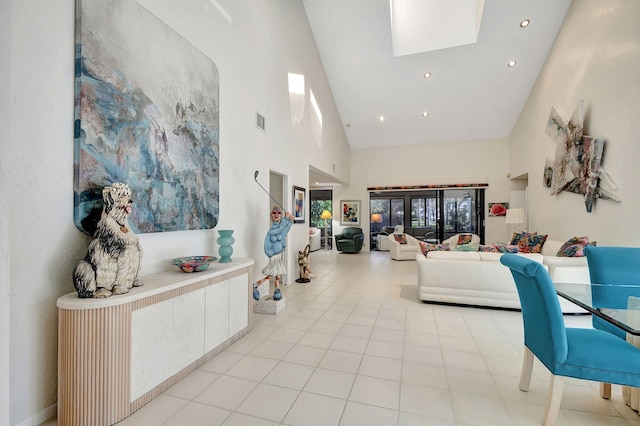 tiled living room featuring high vaulted ceiling