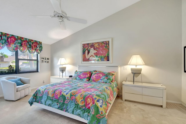 carpeted bedroom with ceiling fan and lofted ceiling