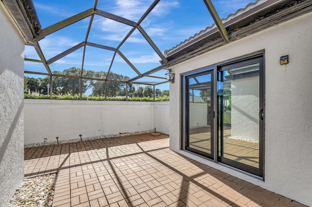 view of patio / terrace with a lanai