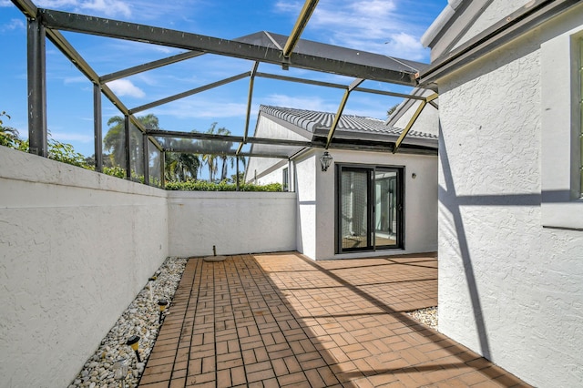 view of patio with a lanai