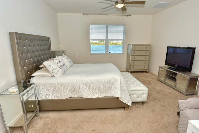 bedroom featuring ceiling fan and light carpet