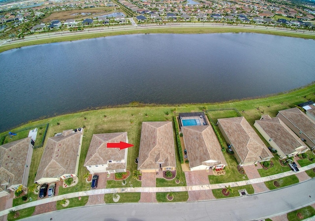 birds eye view of property featuring a water view