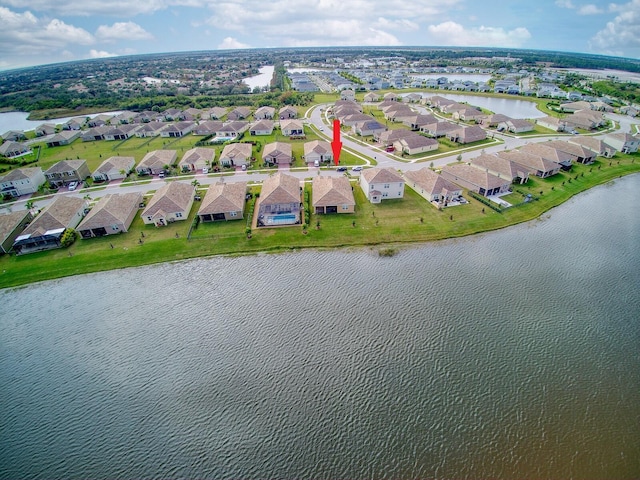 bird's eye view with a water view