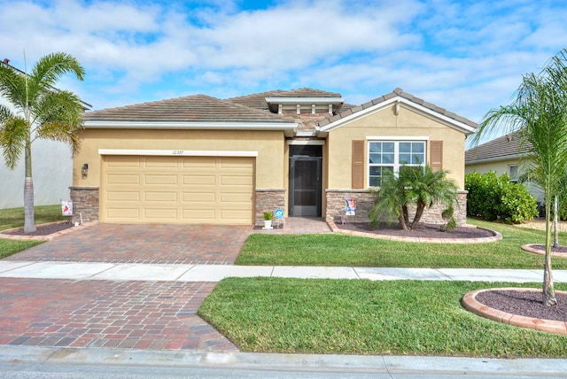 view of front of house with a front lawn and a garage