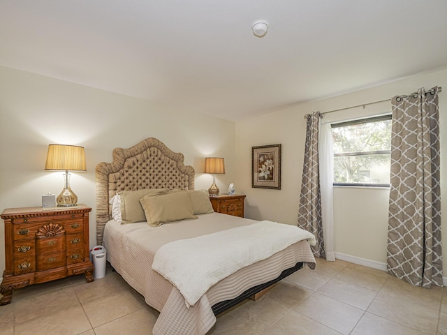 bedroom featuring light tile patterned floors