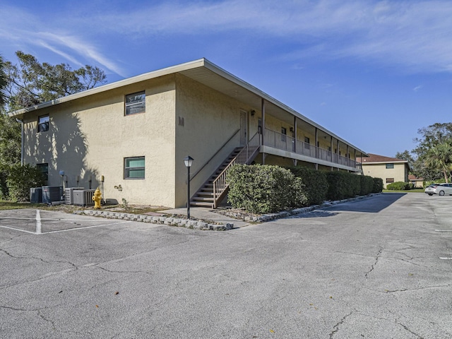 view of building exterior with central air condition unit