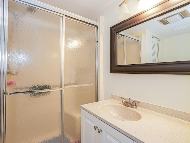 bathroom with vanity and walk in shower