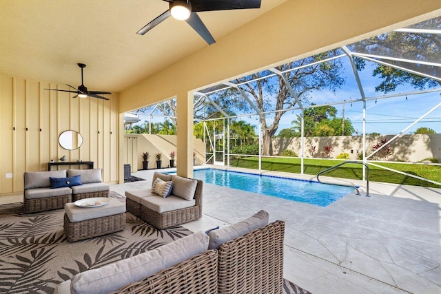 view of swimming pool with ceiling fan, an outdoor hangout area, a patio area, and a lanai