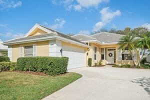 view of front of home with a garage and a front yard