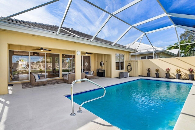 view of pool featuring glass enclosure, ceiling fan, an outdoor living space, central air condition unit, and a patio area