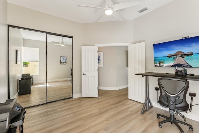 office space with ceiling fan and light hardwood / wood-style flooring