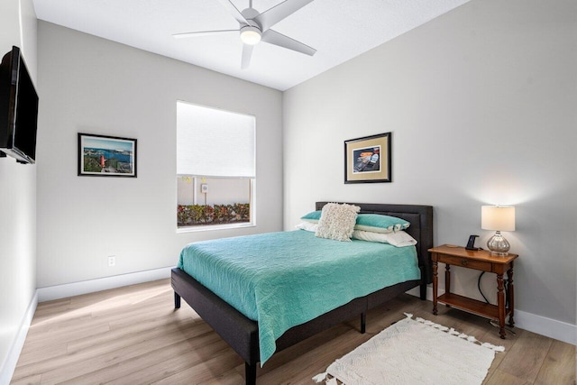 bedroom featuring light hardwood / wood-style floors and ceiling fan