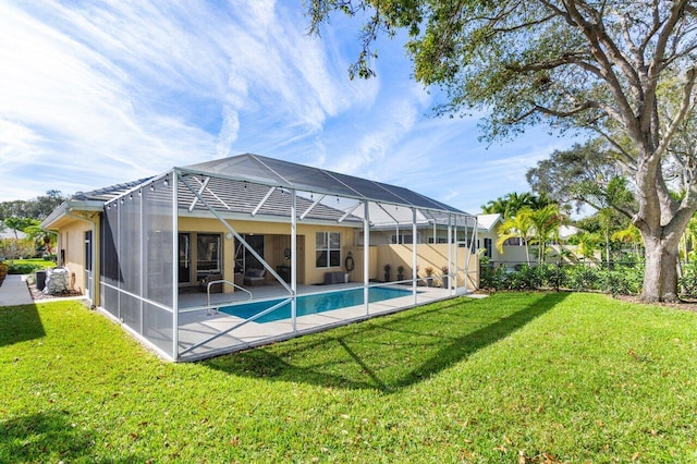 exterior space with a fenced in pool, a lanai, a yard, and a patio