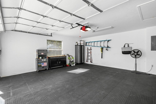 garage featuring a garage door opener, electric panel, and water heater