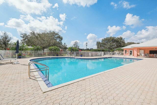 view of pool featuring a patio