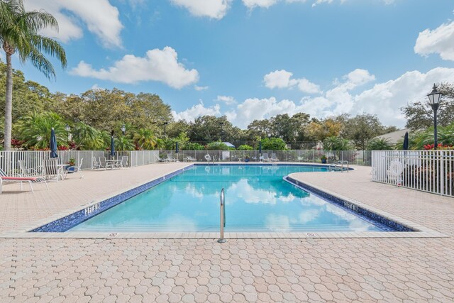 view of swimming pool with a patio