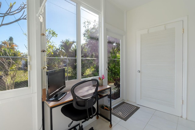 tiled home office featuring a healthy amount of sunlight