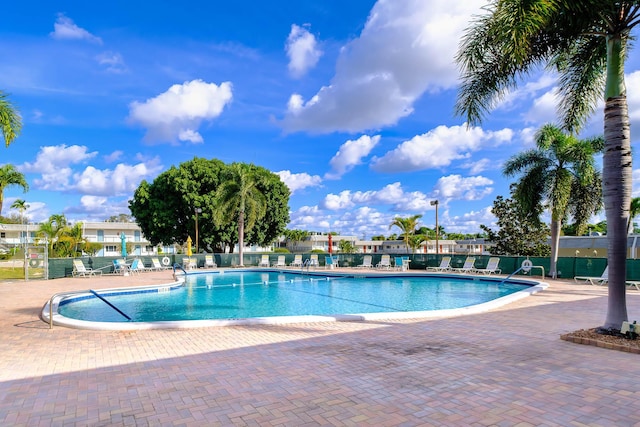 view of swimming pool featuring a patio area