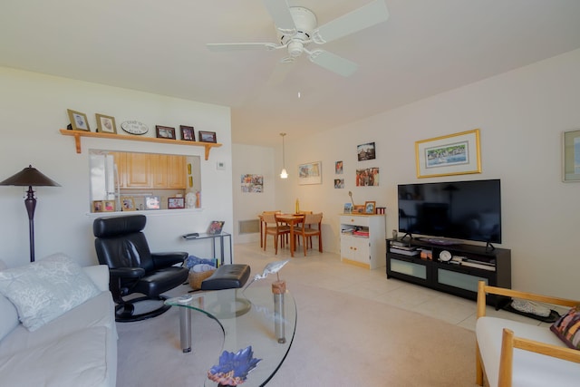 living room with ceiling fan and light tile patterned floors