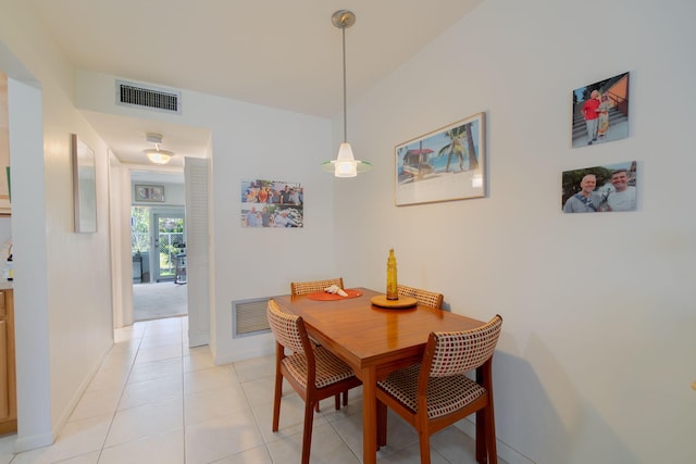 dining space featuring light tile patterned floors