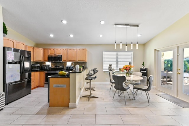 kitchen featuring french doors, hanging light fixtures, tasteful backsplash, light tile patterned floors, and black appliances