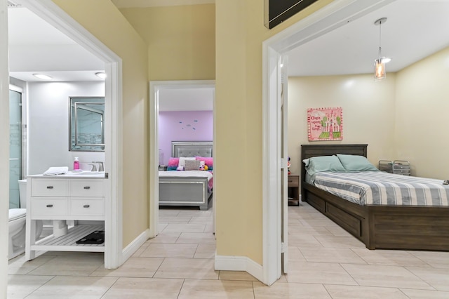 tiled bedroom with sink