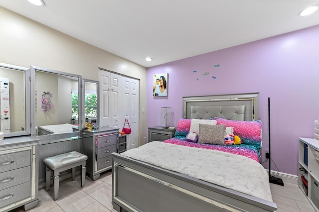 tiled bedroom with a closet