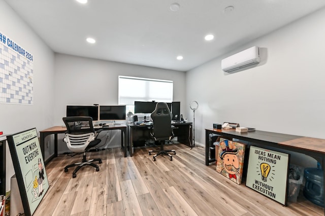 office area featuring a wall mounted AC and light wood-type flooring