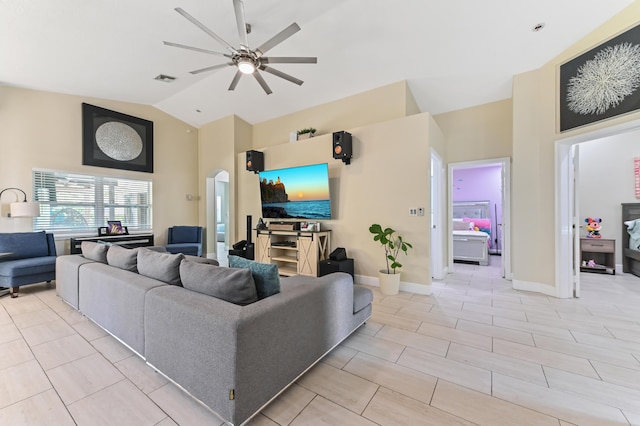 living room with ceiling fan and vaulted ceiling