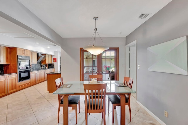 tiled dining space with french doors