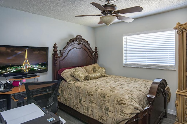 bedroom with dark hardwood / wood-style flooring, a textured ceiling, and ceiling fan