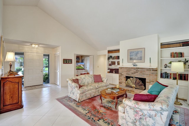 living room featuring built in shelves, light tile patterned flooring, high vaulted ceiling, and a brick fireplace