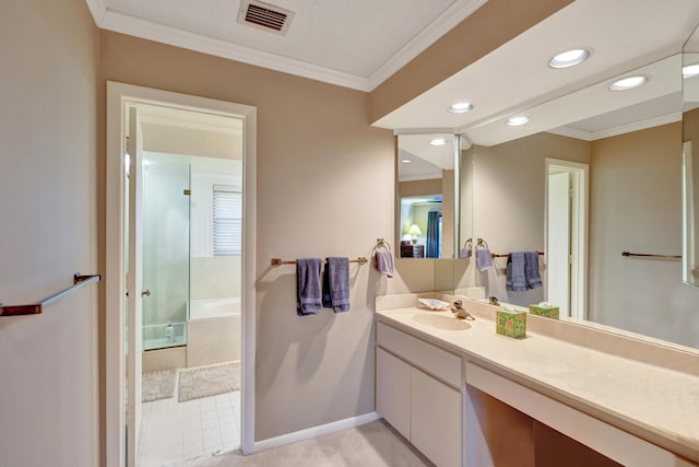 bathroom with vanity, a shower with shower door, and ornamental molding