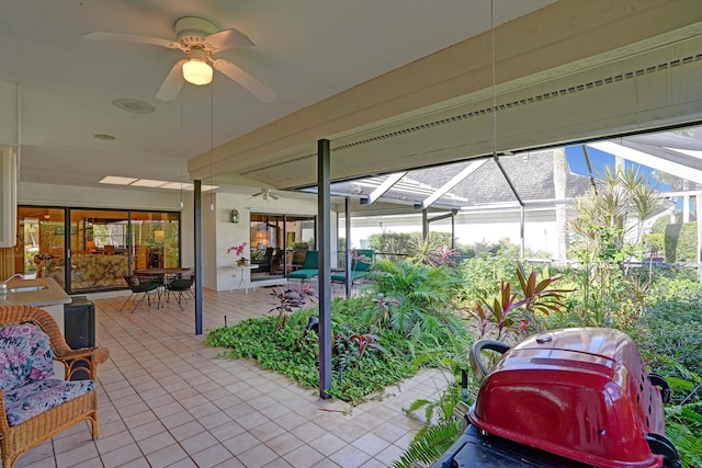 sunroom / solarium with ceiling fan