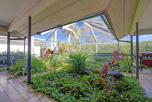 view of patio with glass enclosure