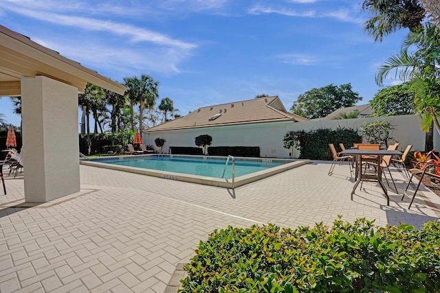 view of pool featuring a patio