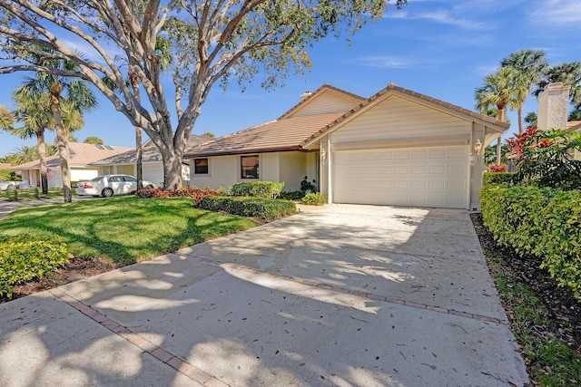 view of front facade featuring a garage and a front lawn