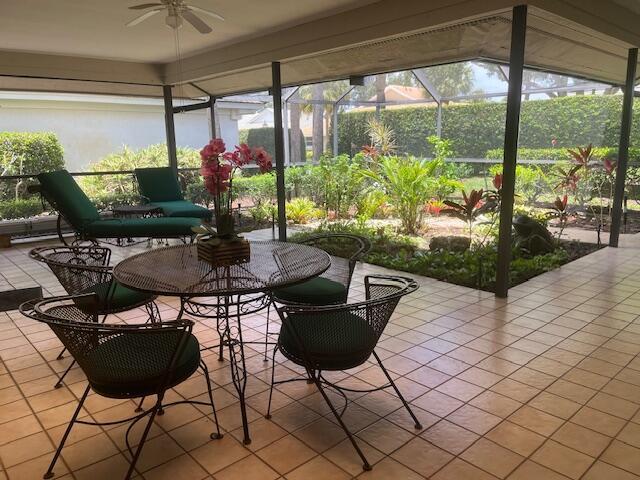 17001 Freshwind Cir, Jupiter, FL 33477 - sunroom with ceiling fan and tile patterned floors