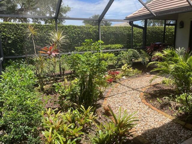 17001 Freshwind Cir, Jupiter, FL 33477 - view of yard with a lanai