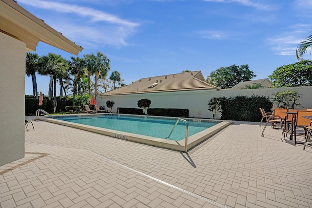 17001 Freshwind Cir, Jupiter, FL 33477 - community pool featuring a patio area