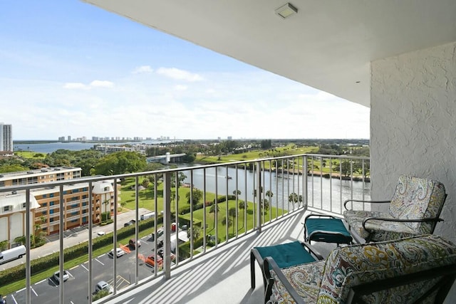 balcony featuring a water view