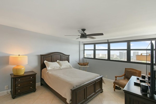 tiled bedroom with ceiling fan