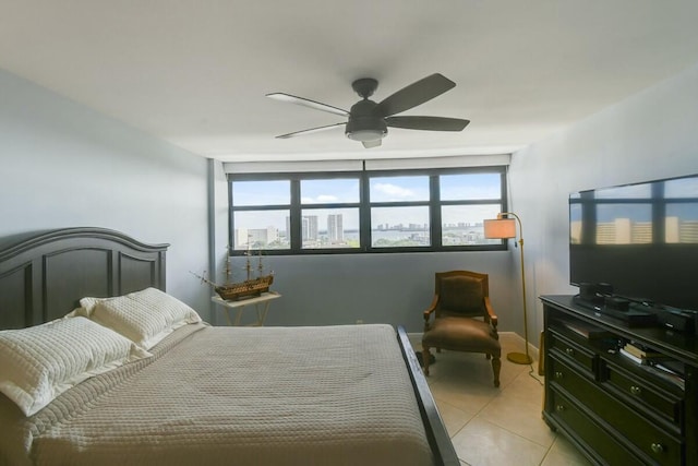 tiled bedroom with ceiling fan