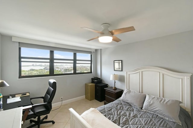 tiled bedroom with ceiling fan