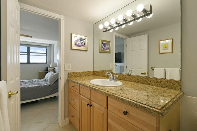 bathroom featuring tile patterned flooring and vanity