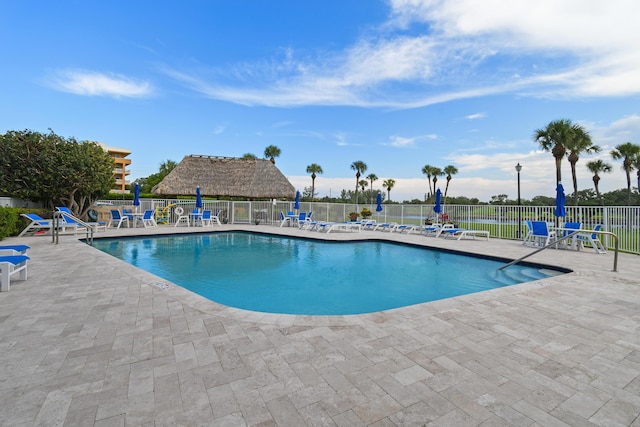 view of swimming pool featuring a patio area